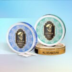 Two Round Alibarbar Mint Tins with Teal and Blue Decorative Lids on a Pastel Gradient Background White Sachets in Front - Australia E-cigarette Store