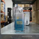 Disposable Vape Device with Gradient Blue-to-silver Body Wrapped in Plastic Labeled 210°c Watermelon Ice on a Warehouse Shelf - Australia E-cigarette Store